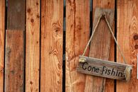 Brown Wooden Signage on Brown Wooden Wall