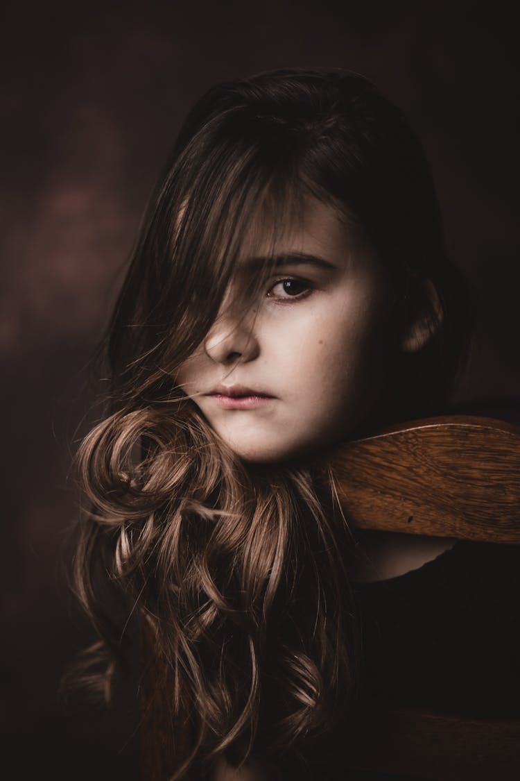 Serious Stylish Girl With Makeup On Brown Background