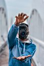 Man in Blue Hoodie Holding Black Dslr Camera