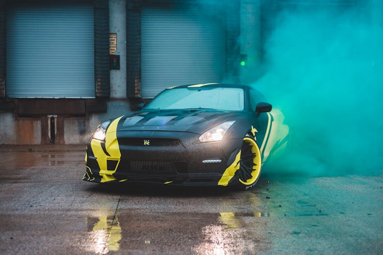 Luxury Sport Car In Bright Blue Smoke