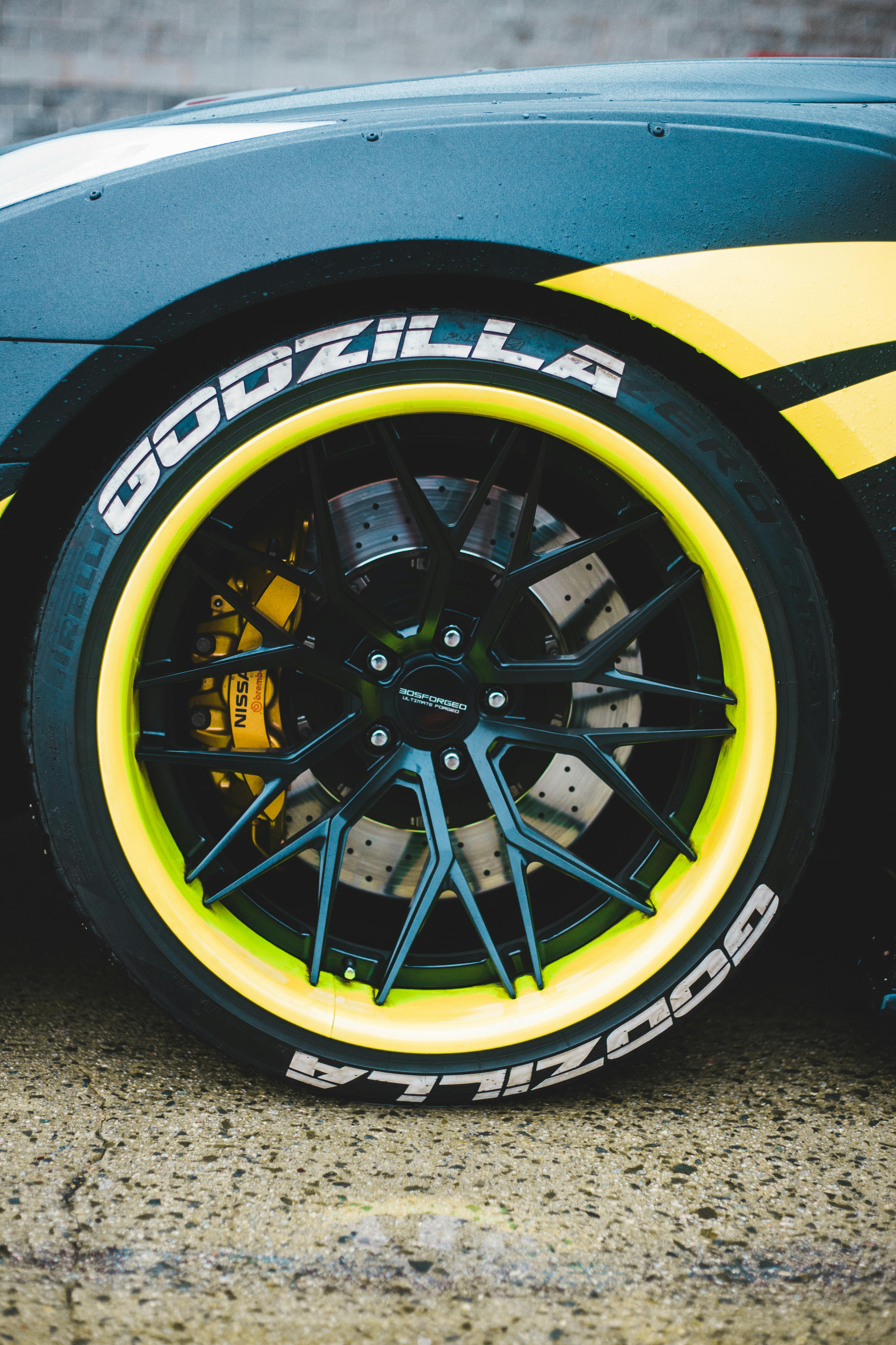 wheel of sport car on stone surface