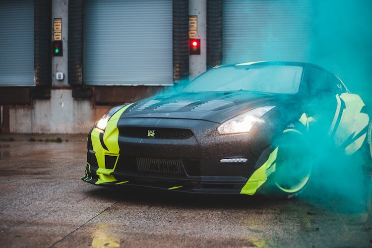 Sport Car In Bright Colorful Smoke