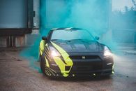Luxury car in green smoke