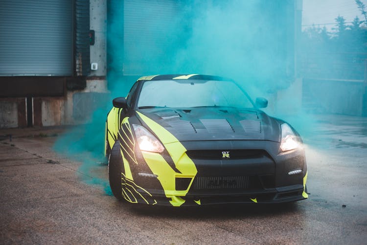 Luxury Car In Green Smoke