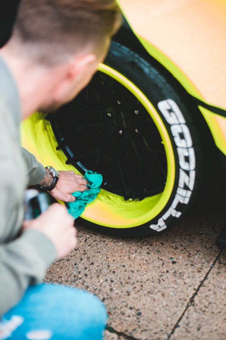 Anonymous Man Polishing Car Disc