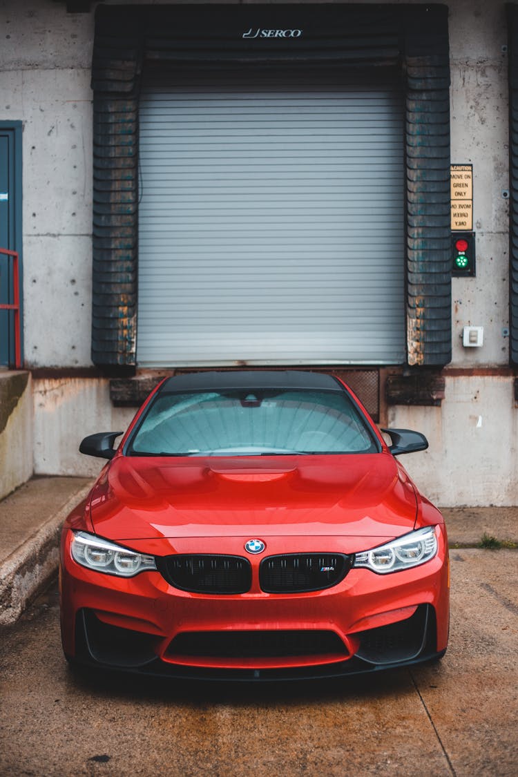 Modern Car Parked Near Wall