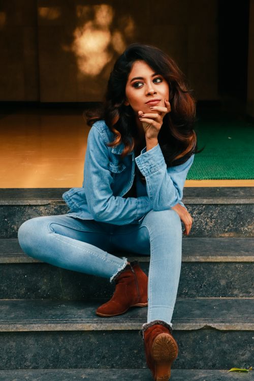 Woman in casual white top and jeans