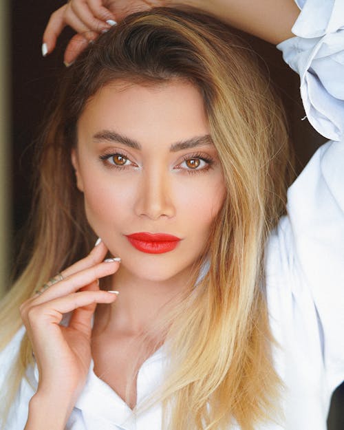 A Woman in White Long Sleeve Shirt