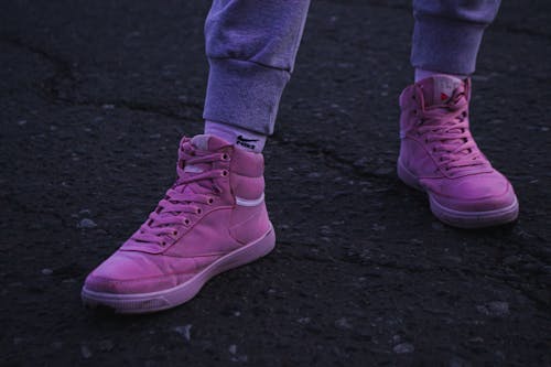 
A Close-Up Shot of a Person Wearing Purple Sneakers
