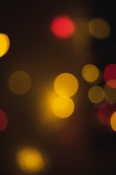 Vibrant abstract bokeh light circles with a warm tone, offering a blurred, dreamy effect.