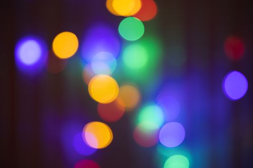 Free Vibrant bokeh lights in various colors creating an abstract background. Stock Photo