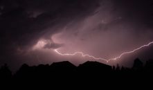 Silhouette of Mountain Under Orange Clouds