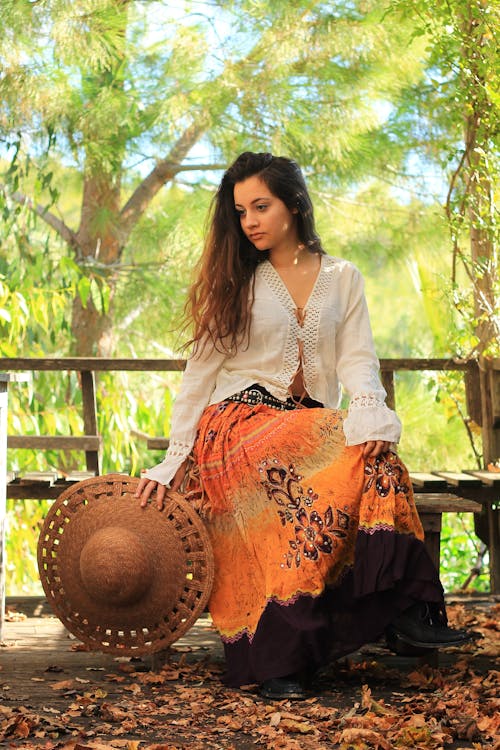 Stylish woman sitting on bench