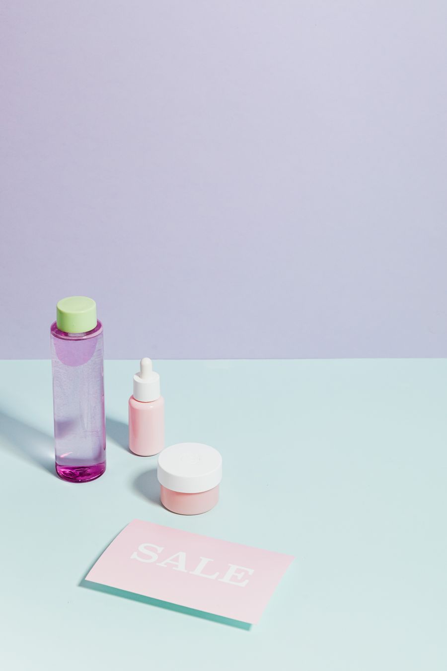 Beauty product flat lay with sale card
