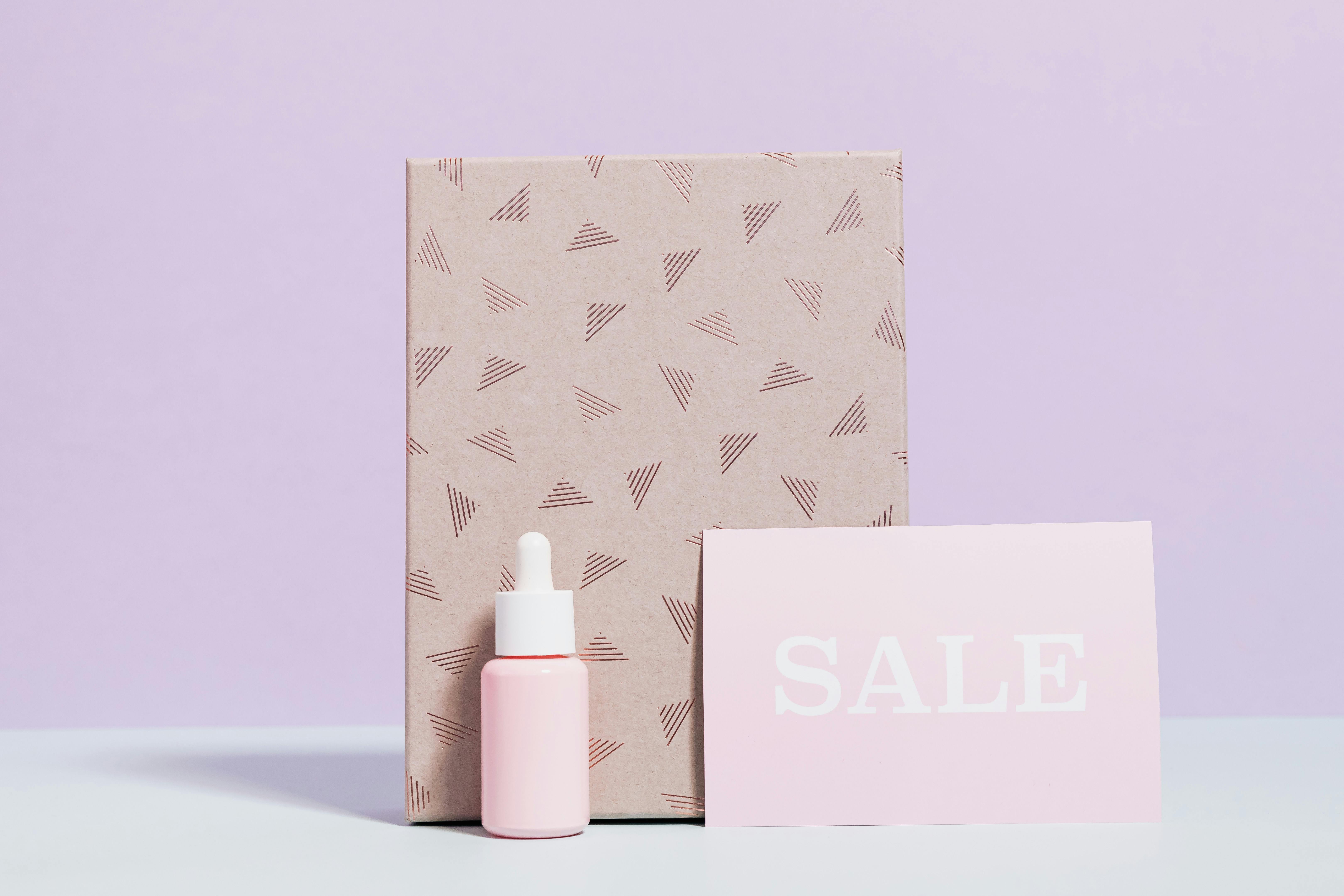 healthcare product in pink bottle with printed paper bag on sale