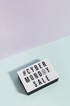 A minimalist lightbox showcasing 'Cyber Monday Sale' against a pastel background, perfect for online shopping promotions.