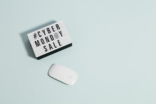 Minimalist design depicting Cyber Monday sale concept with a white mouse on pastel background.