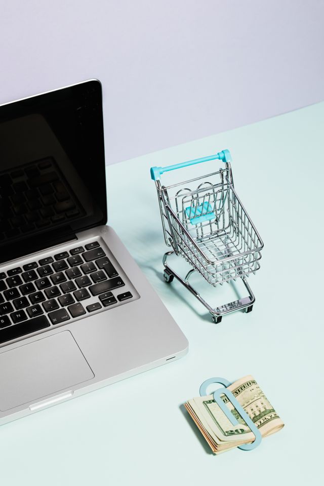 Laptop with a miniature shopping cart