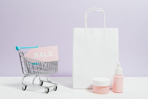 White Paper Bag Beside Stainless Steel Shopping Cart