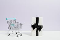 Shopping Cart Next to a Gift Box