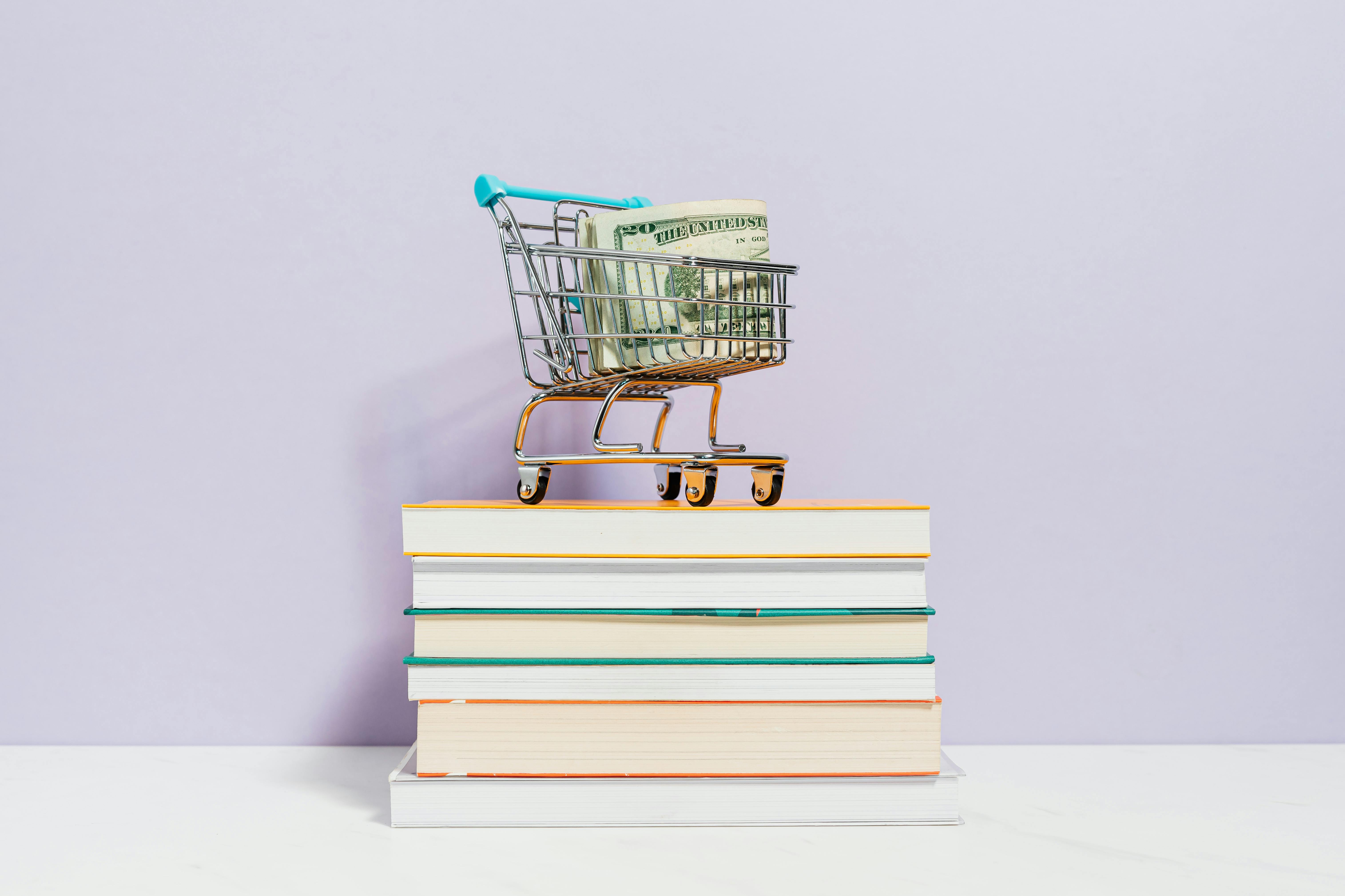 shopping cart on top of books