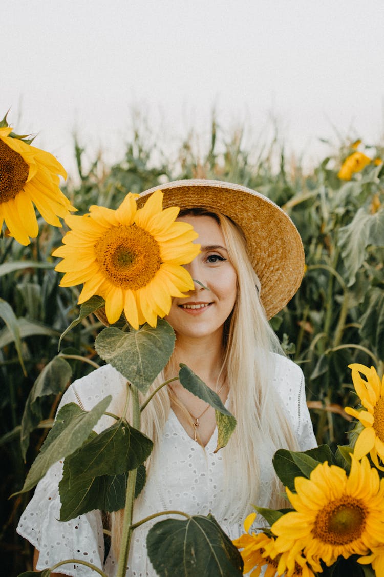 Beautiful Woman Near Sunflowers