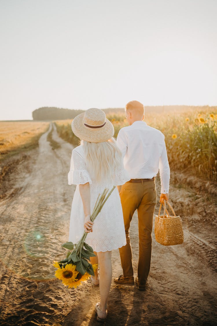 Back View Of A Couple Walking Together