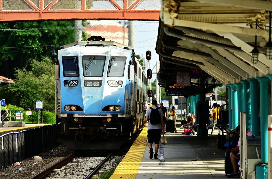 Tri-Rail Records 4th Busiest Saturday Following Inter Miami CF Match on April 11 2 Blue train approaches a bustling station, capturing daily commute life. | BocaVibe