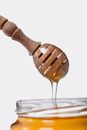 Brown Wooden Spoon on Clear Drinking Glass