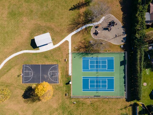 Free Aerial View of a Tennis Court and Basketball Court Stock Photo