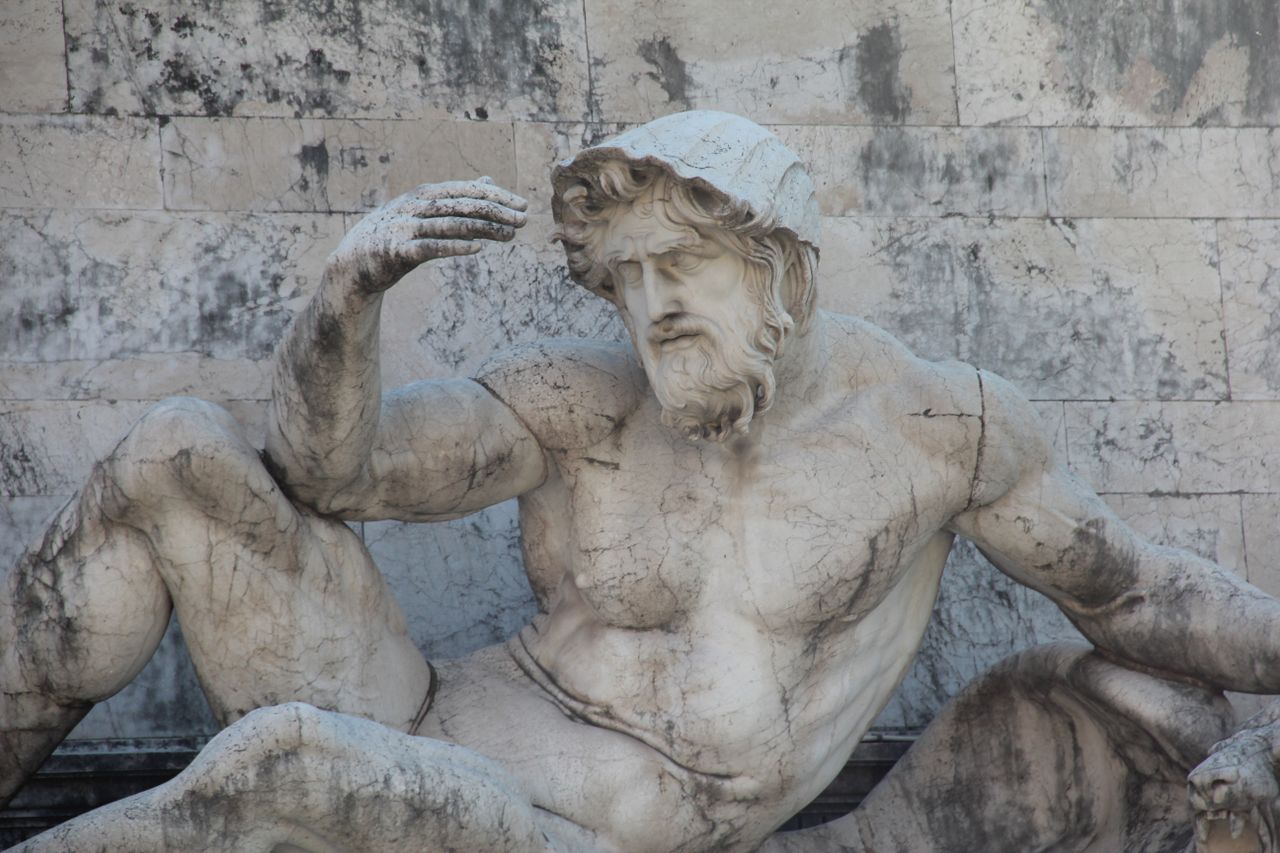 close up of a muscular mythological marble sculpture with a classic re