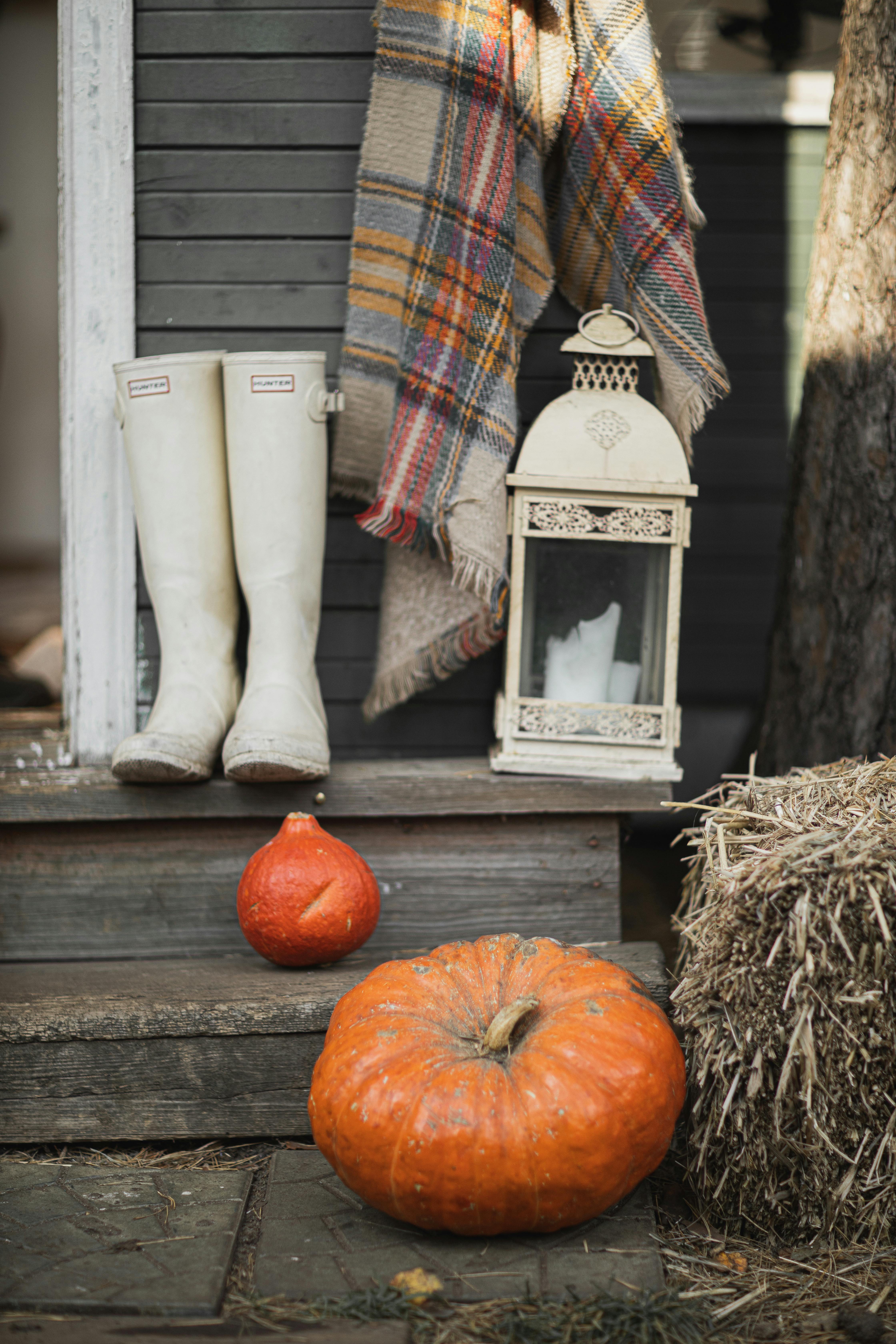 white boots and orange pumpkin on the stair