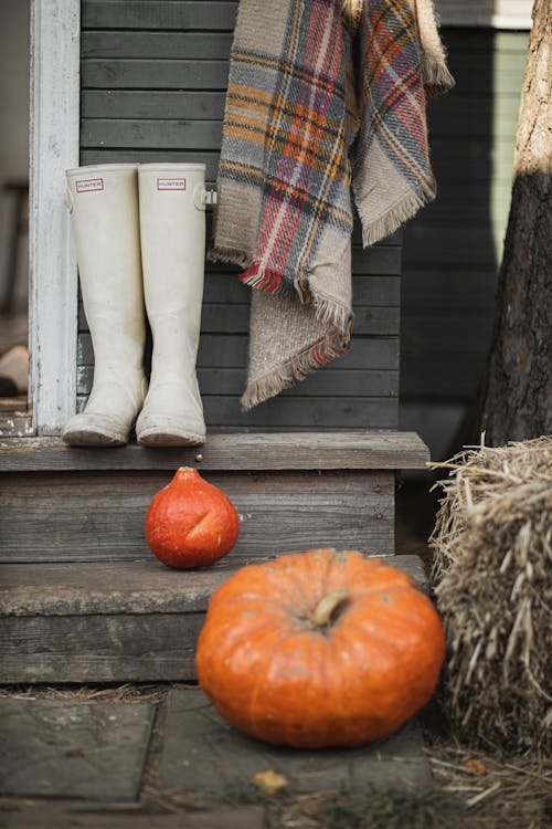 White Boots and Orange Pumpkin on the Stair