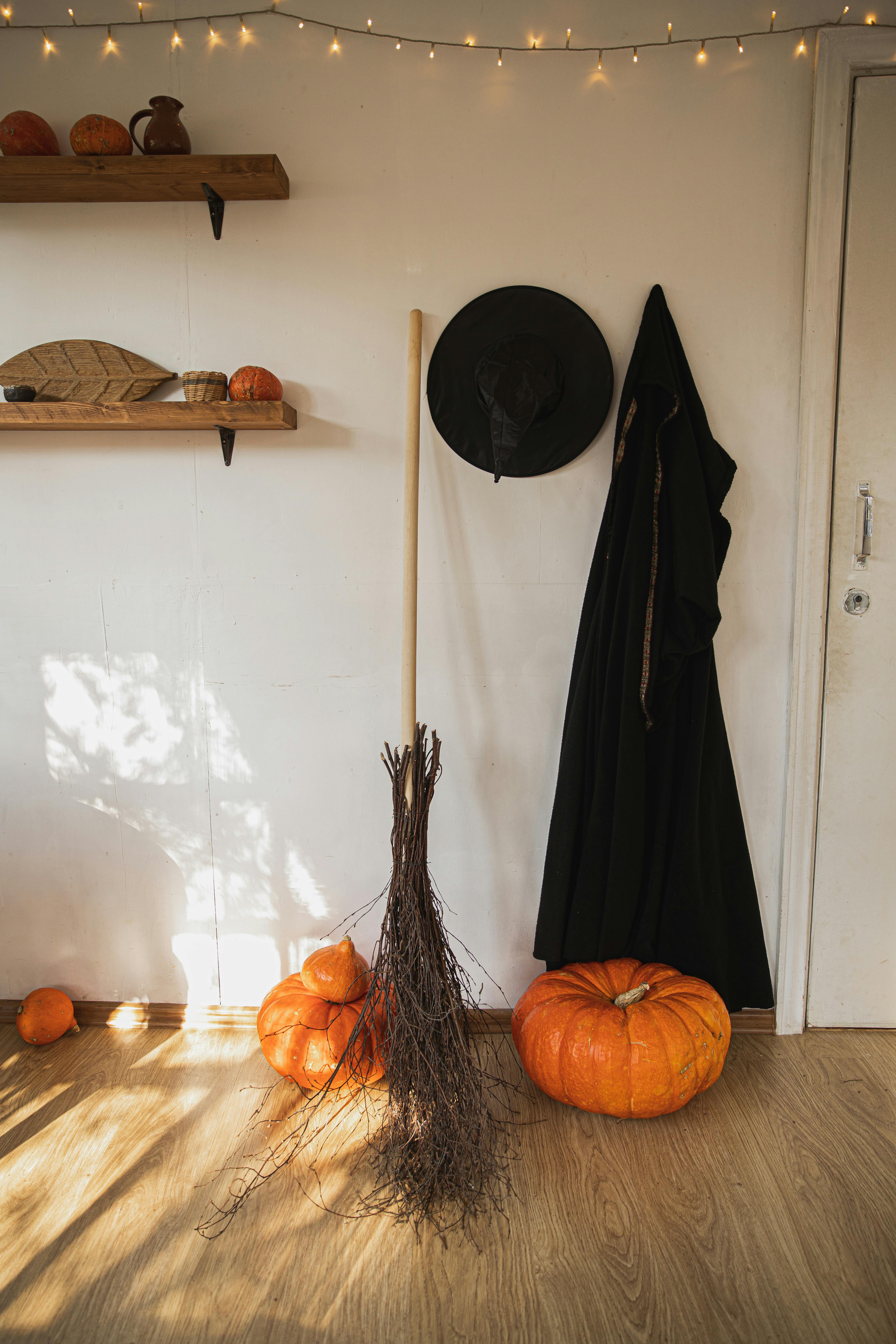witch costume and pumpkin in a room