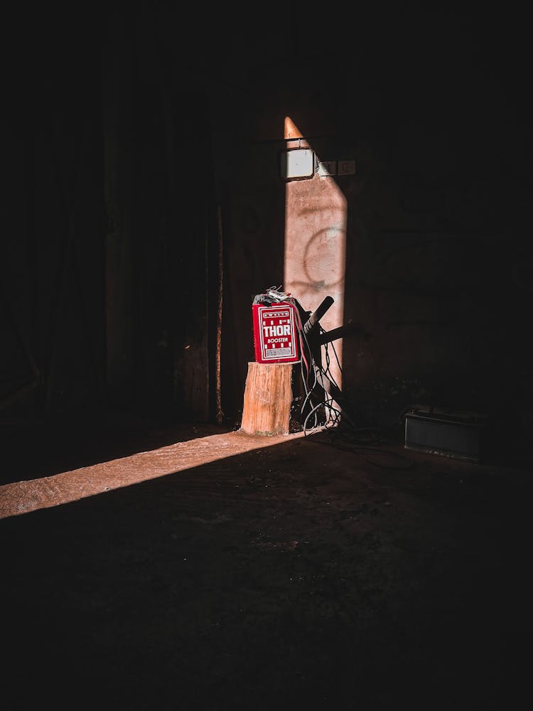 Ray Of Light Illuminating Red Canister