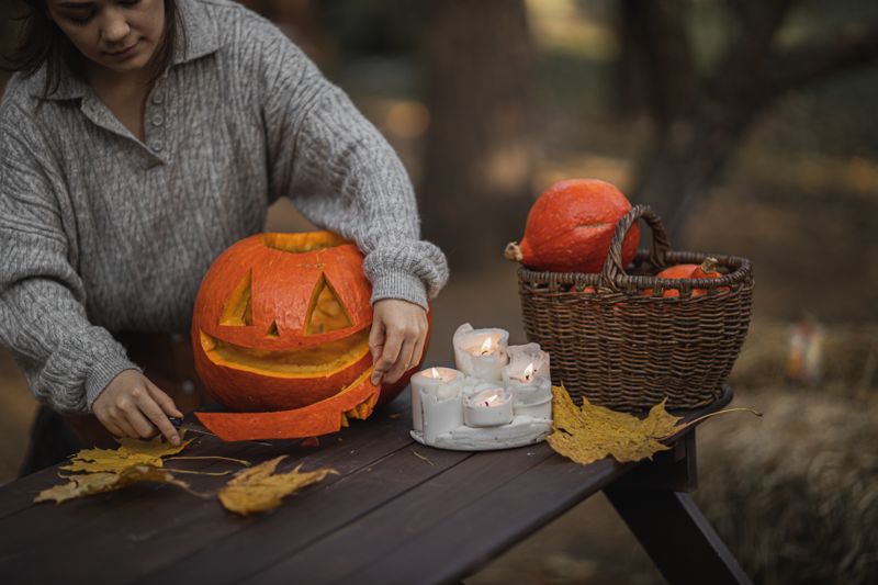 Pumpkin decorating craft table at a Halloween party