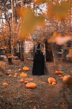 Spooky Halloween scene featuring a witch in a magical autumn forest surrounded by pumpkins.