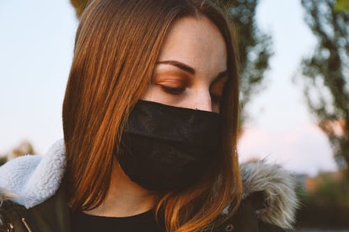 A Woman Wearing Black Face Mask