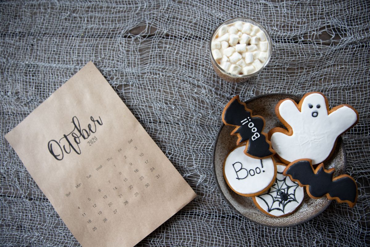 Halloween cookies on a rustic table, ready to pack into goodie bags