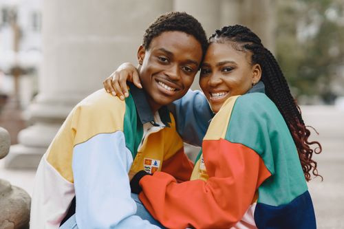 Free Smiling young couple embracing, showcasing joy and connection. Stock Photo