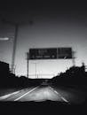 Grayscale Photography Expressway During Night