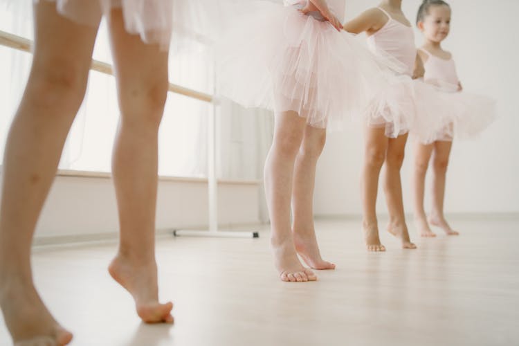 Low Angle View On Small Ballerinas Legs