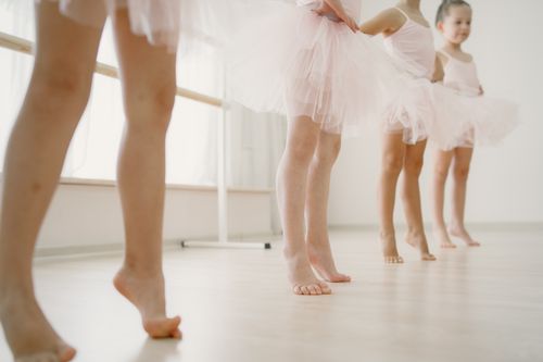 Free Young ballerinas practicing ballet in a studio, showcasing delicate movements and grace. Stock Photo