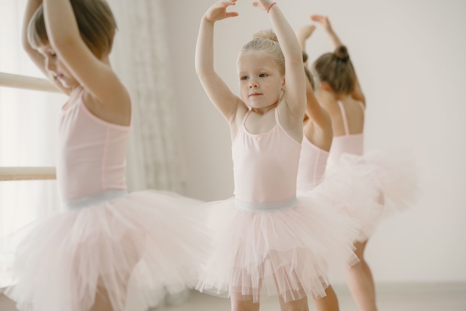 Dance fitness class participants repeating choreography together for faster skill building