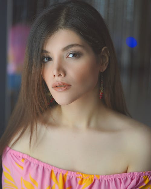 Portrait of a Woman in Pink and Yellow Off Shoulder Top