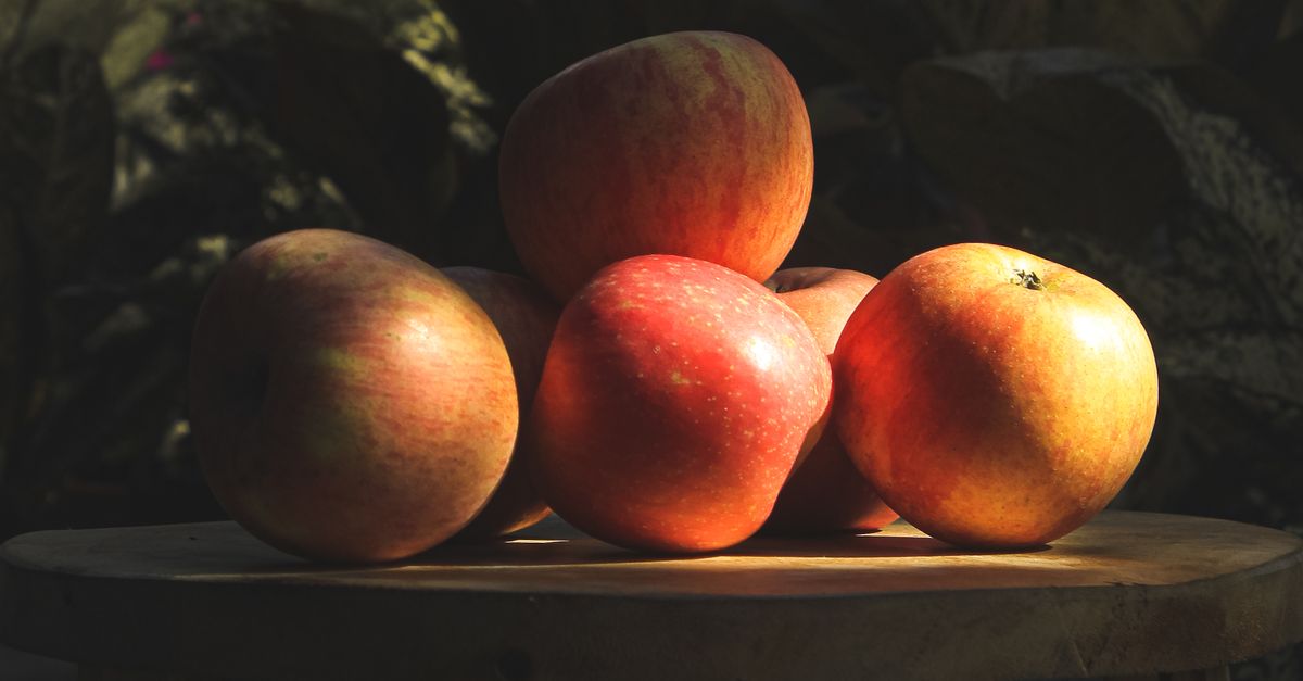 Delicious Apples on Brown Wooden Stool · Free Stock Photo