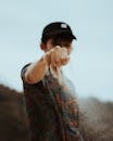 Wistful man pouring sand through fingers