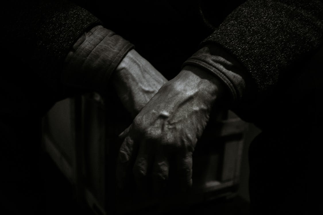 Grayscale Photo of Person's Hands · Free Stock Photo