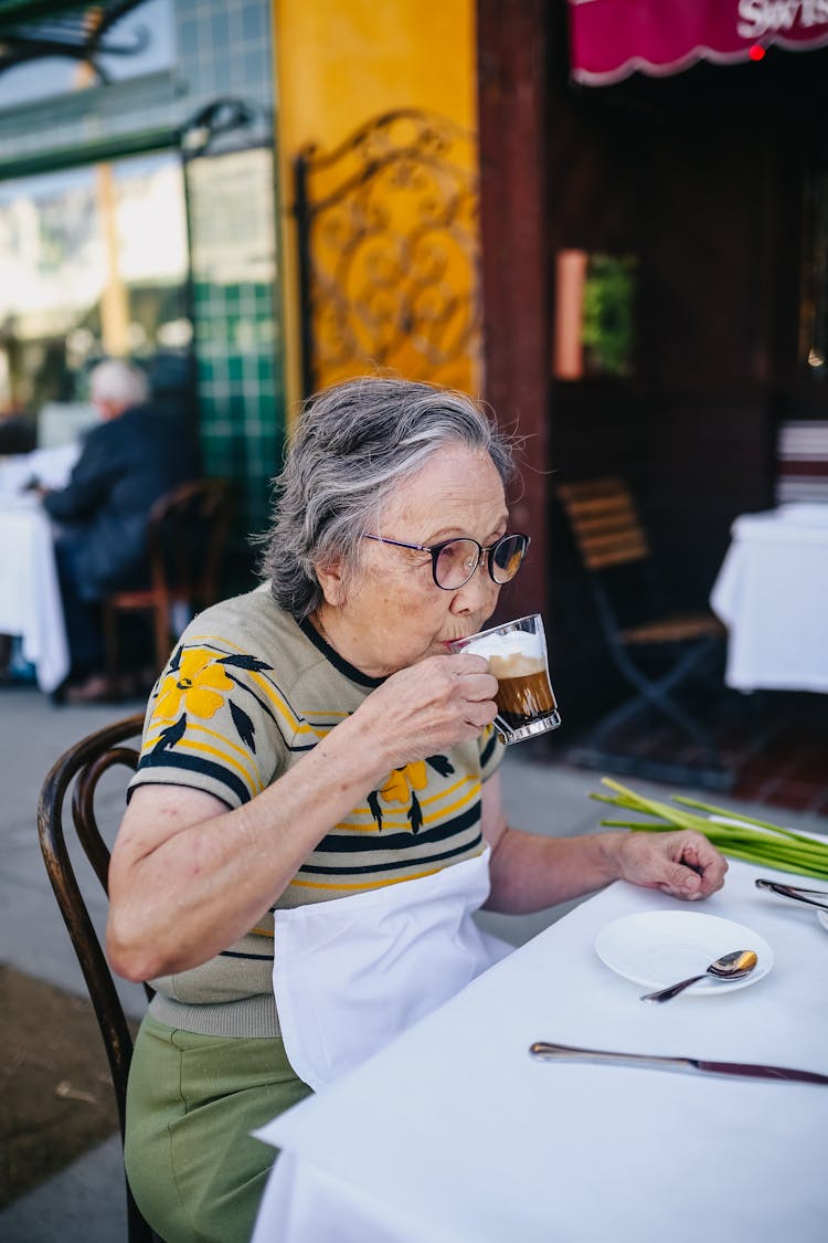 Elderly Woman Drinking Coffee