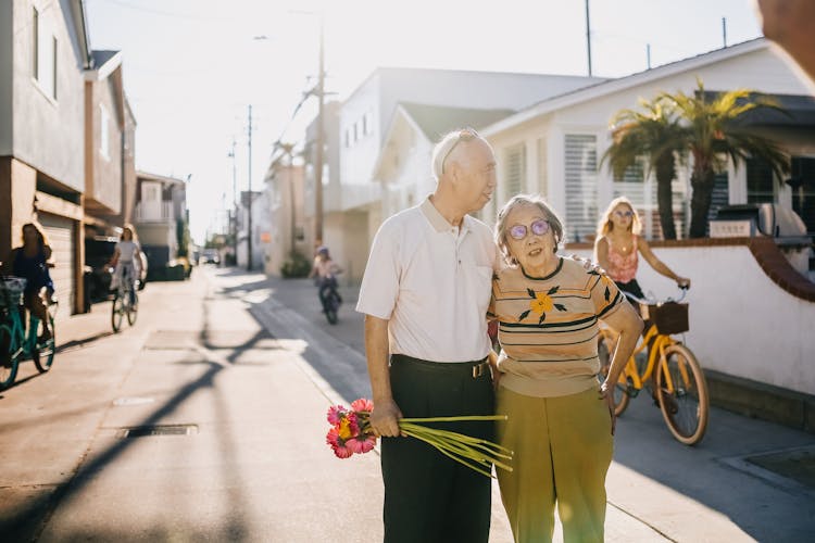 Elderly Couple Standing On The Street